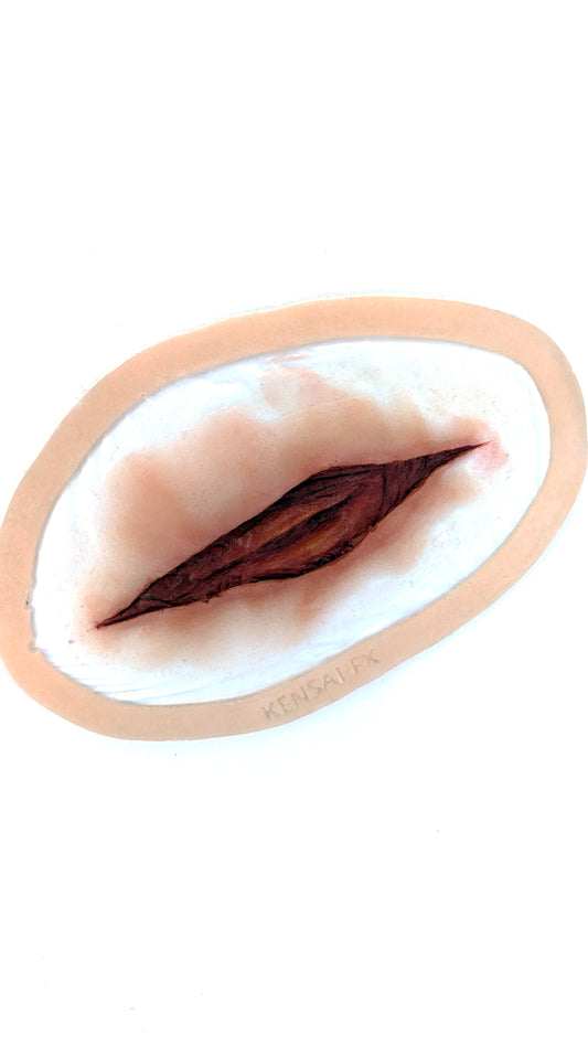 Pre-Painted Large Laceration Cut-Throat Encapsulated Silicone Prosthetic